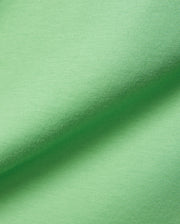 Psycho Bunny Mens Classic Crew Neck Tee in vibrant lime green, crafted from premium, ultra-soft jersey knit fabric, showcasing subtle texture and elegant folds. (6)