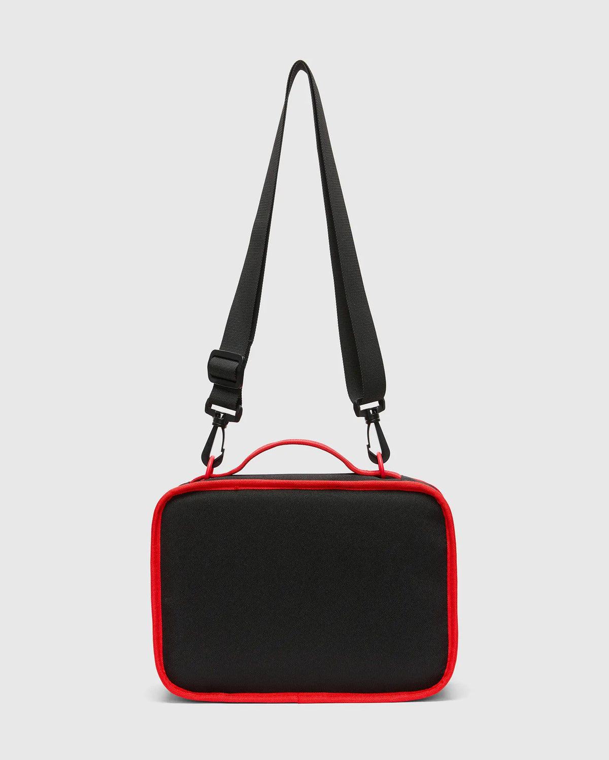 Kids Pal Lunch Box, sleek black durable fabric with vibrant red piping, a sturdy top handle, and an adjustable black shoulder strap featuring red carabiner clips. (3)