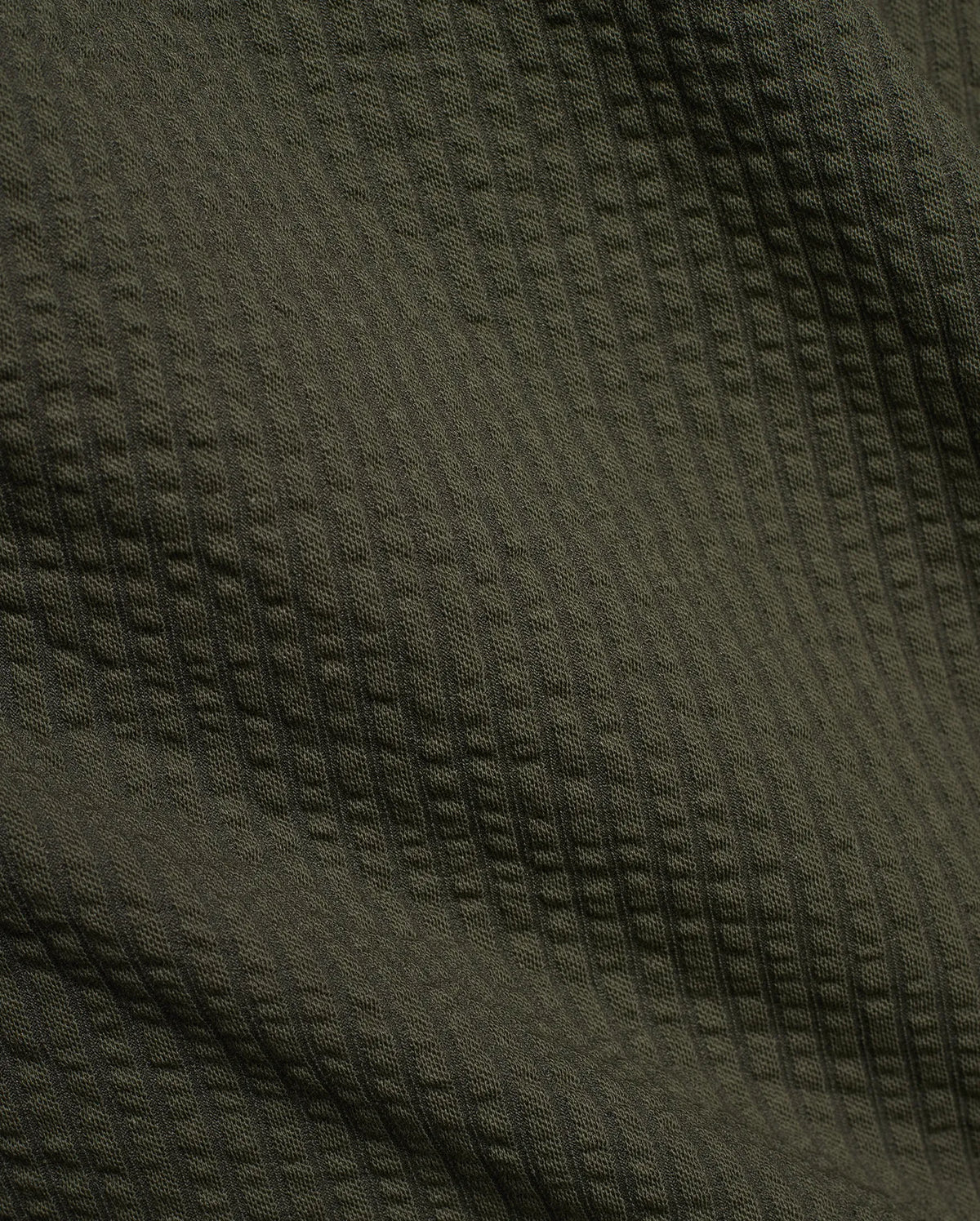 Psycho Bunny Mens Arlen Seersucker Short in dark olive green, featuring a classic seersucker fabric with a distinct puckered, vertically striped texture. (6)