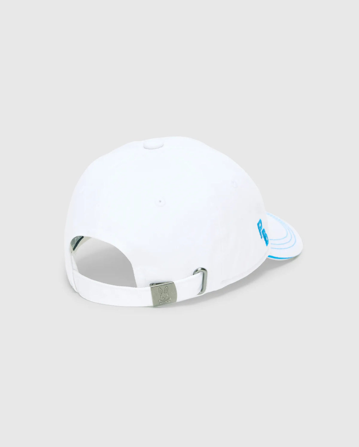 White Mens Ray Baseball Cap with blue embroidered PB logo on the side, blue concentric lines on the brim, and an adjustable strap featuring a metal buckle with an engraved Psycho Bunny skull. (4)