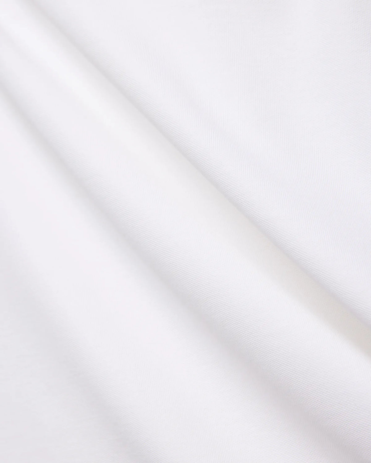 Crisp White Mens Brad Pique Polo fabric, highlighting its distinctive textured pique weave, soft, luxurious feel, and elegant folds, embodying premium Psycho Bunny menswear. (6)