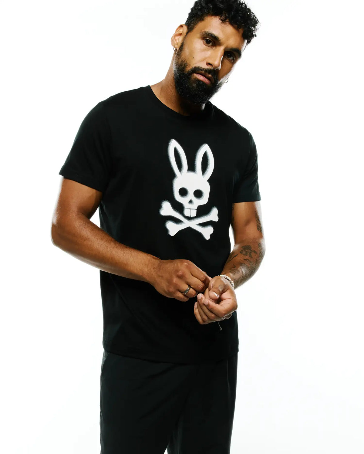 Black Pima cotton jersey Mens Emmanuel Pima Cotton Graphic Tee with a classic fit, featuring a large white Psycho Bunny skull and crossbones graphic prominently centered on the chest. (2)