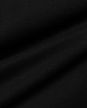 Men's Conan Pima Back Graphic Tee, a premium black Pima cotton jersey fabric, showcasing its fine, soft texture and subtle diagonal ribbing from the knit, with gentle folds. (6)