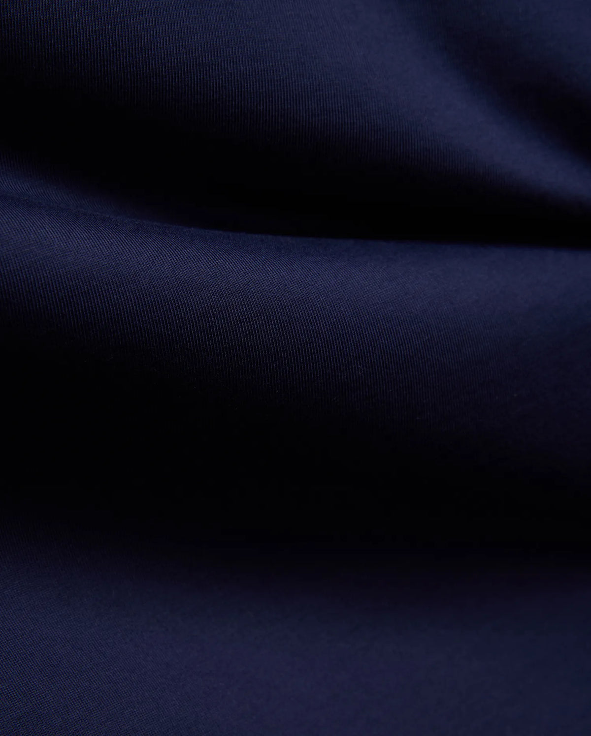 Mens John Graphic Tee, a premium Psycho Bunny dark navy blue t-shirt, showcasing its refined, soft, finely textured jersey knit fabric with elegant, flowing folds, perfect for refined streetwear. (6)