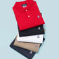 Stack of five Psycho Bunny men's classic polo shirts in different colors (red, black, white, blue, beige) with a small Psycho Bunny logo on the chest, neatly folded on a light blue background.