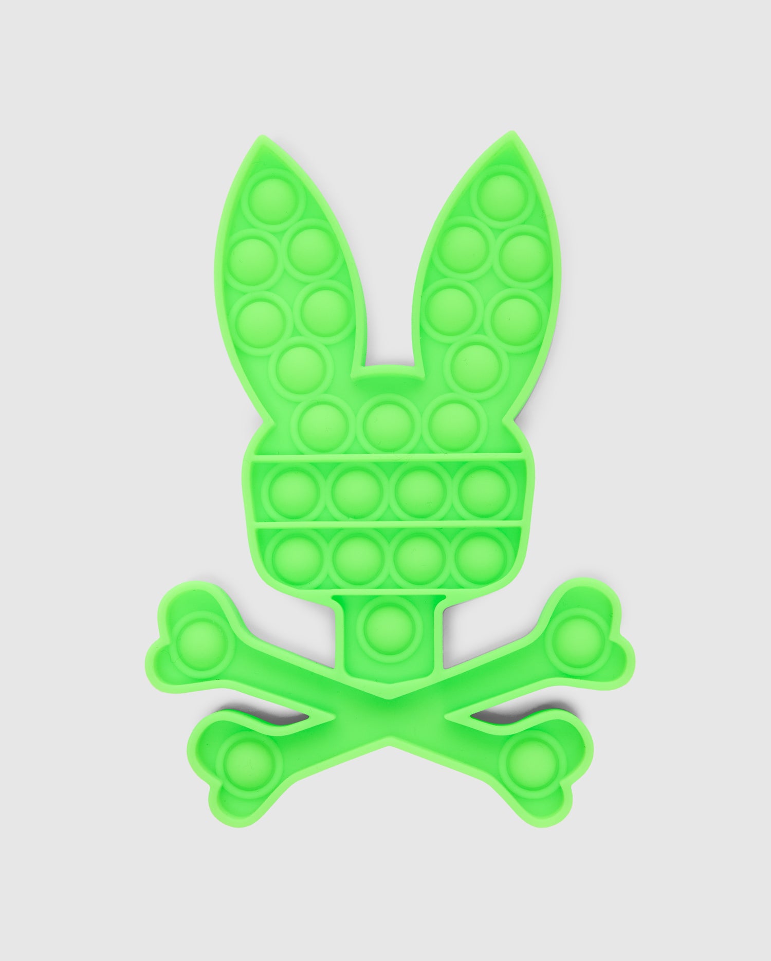 Introducing the PSYCHO BUNNY POP IT - B0A376E200 by Psycho Bunny, a premium silicone fidget toy designed in the shape of a bunny head above a crossbones, set against a white background.