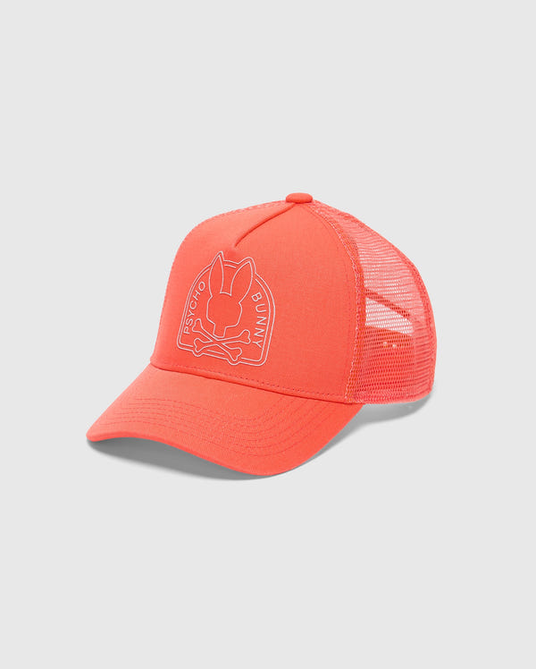 The KIDS MELBOURNE GRAPHIC TRUCKER HAT - B0A548F200 by Psycho Bunny features an embroidered bunny head with crossed bones and "Psycho Bunny" text on a bright orange cap. It has a mesh back and adjustable snap-back strap for comfort.