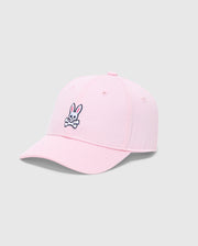 The KIDS CLASSIC BASEBALL CAP - B0A816A1HT by Psycho Bunny features a cartoon bunny with crossbones logo embroidered on the front panel. This light pink cap offers an adjustable fit, displayed against a plain gray background.