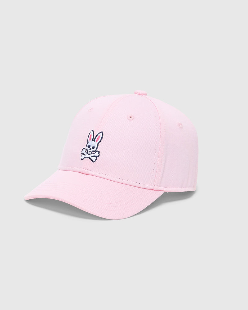 The KIDS CLASSIC BASEBALL CAP - B0A816A1HT by Psycho Bunny features a cartoon bunny with crossbones logo embroidered on the front panel. This light pink cap offers an adjustable fit, displayed against a plain gray background.