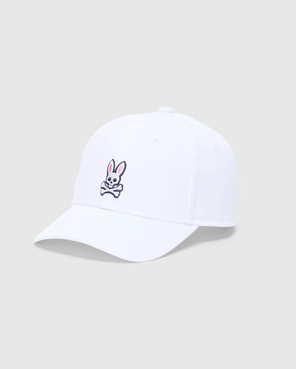 The KIDS CLASSIC BASEBALL CAP - B0A816A1HT by Psycho Bunny is a white cap with a curved brim and adjustable fit, featuring a pink and white embroidered bunny above crossed bones on the front, set against a plain gray background.