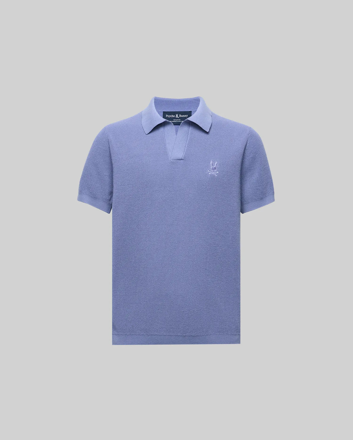 The KIDS LEETON KNIT POLO SHIRT (B0E562F200) by Psycho Bunny is a light purple cotton sweater polo with short sleeves, a Johnny collar, and an embroidered logo on the left chest, shown against a plain light gray background.