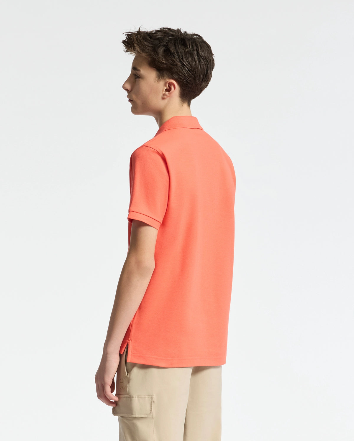 Teen | Kids' hot coral Psycho Bunny classic polo with embroidered logo, ribbed collar, and soft Pima cotton fabric for comfort and style.