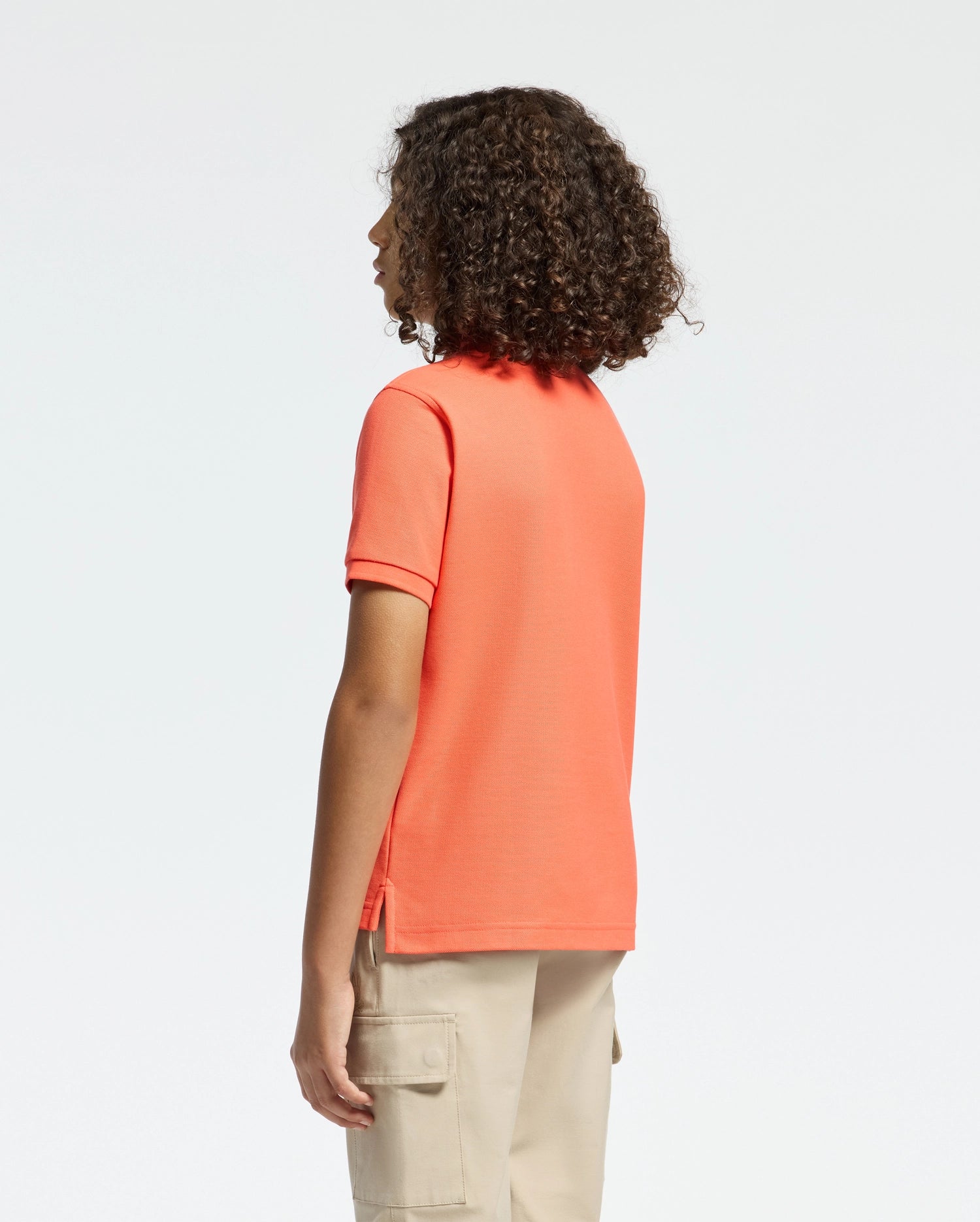 Kids | Kids' hot coral Psycho Bunny classic polo with embroidered logo, ribbed collar, and soft Pima cotton fabric for comfort and style.