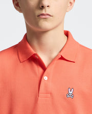 Teen | Kids' hot coral Psycho Bunny classic polo with embroidered logo, ribbed collar, and soft Pima cotton fabric for comfort and style.