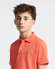 Teen | Kids' hot coral Psycho Bunny classic polo with embroidered logo, ribbed collar, and soft Pima cotton fabric for comfort and style.