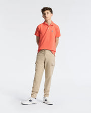 Teen | Kids' hot coral Psycho Bunny classic polo with embroidered logo, ribbed collar, and soft Pima cotton fabric for comfort and style.