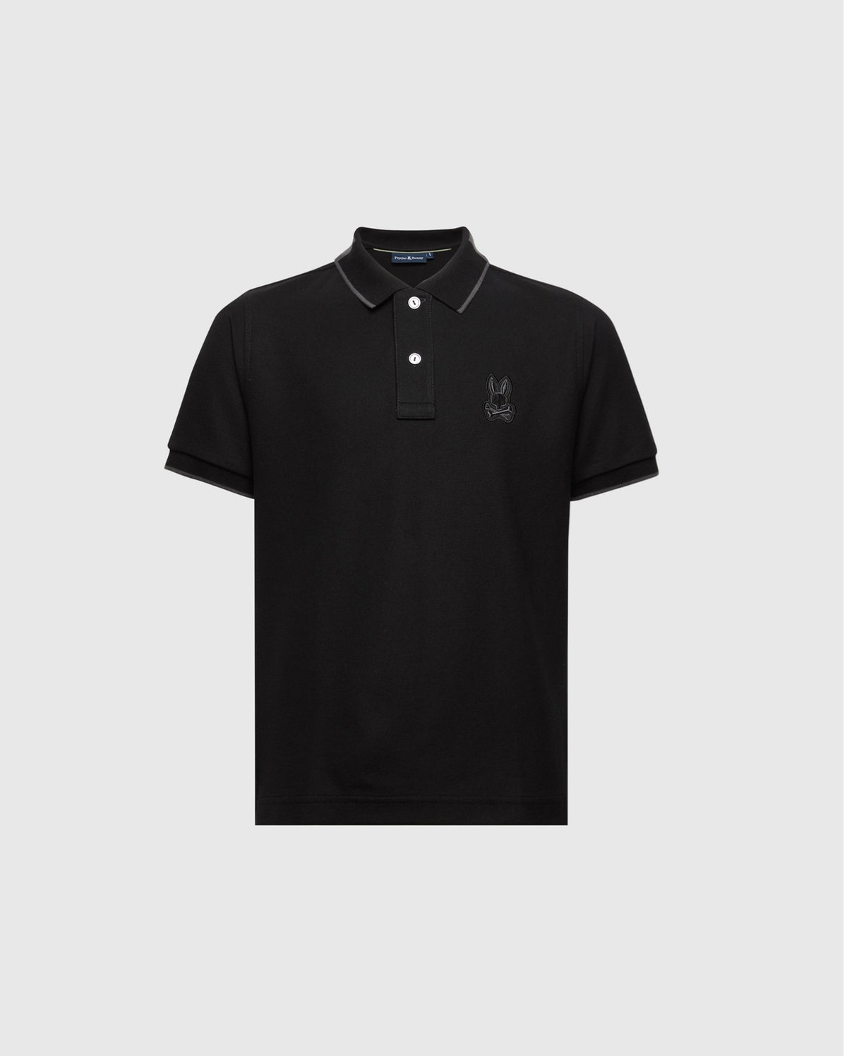 The KIDS NEW CASTLE PIQUE POLO by Psycho Bunny (B0K487F200) is a black polo crafted from luxurious Pima cotton, featuring short sleeves, a buttoned collar, and an embroidered Bunny on the chest. Displayed against a plain white background.
