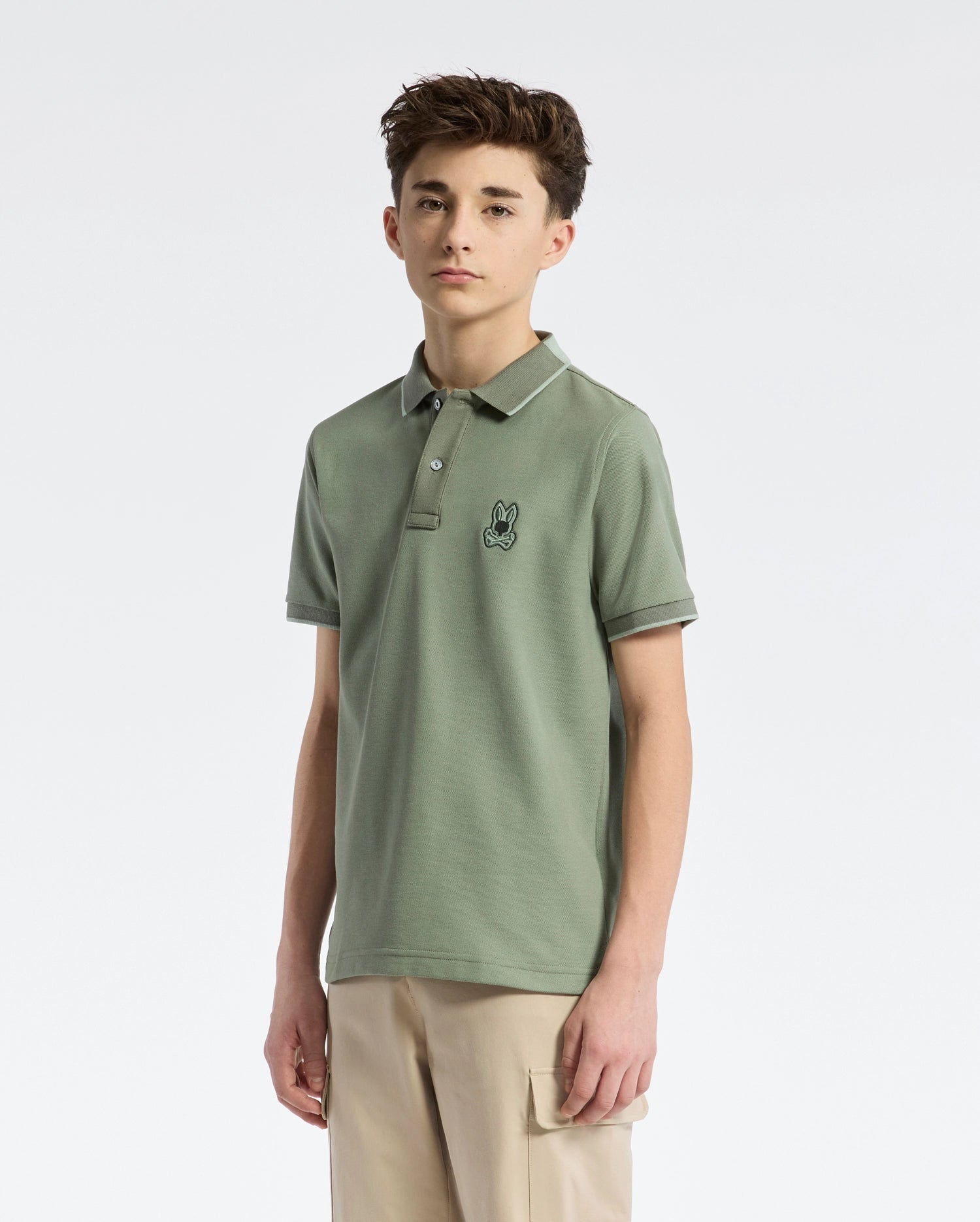 Teen | Kids' New Castle Piqué Polo in green by Psycho Bunny, featuring an embroidered logo and a classic design for a stylish, polished look.