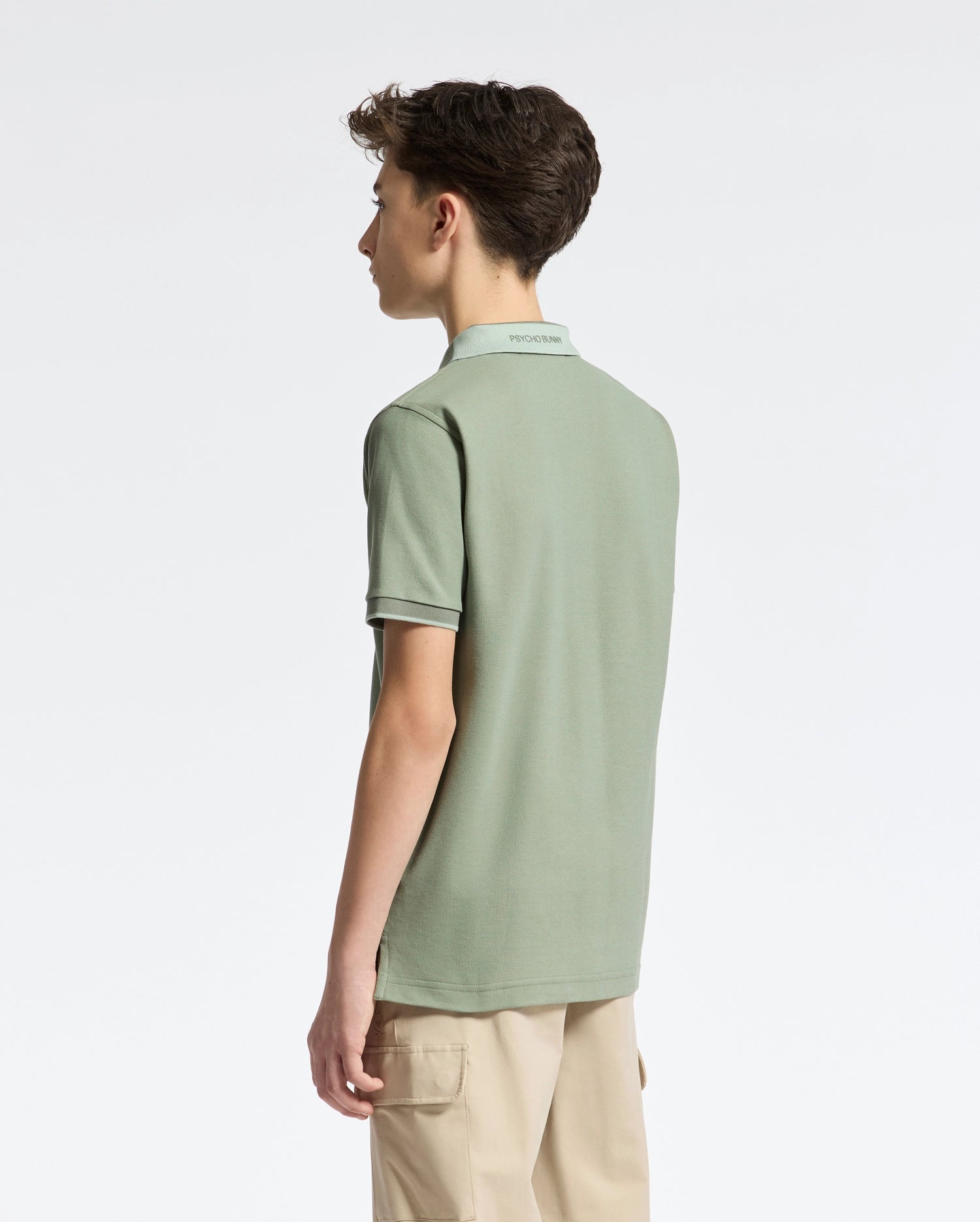 Teen | Kids' New Castle Piqué Polo in green by Psycho Bunny, featuring an embroidered logo and a classic design for a stylish, polished look.