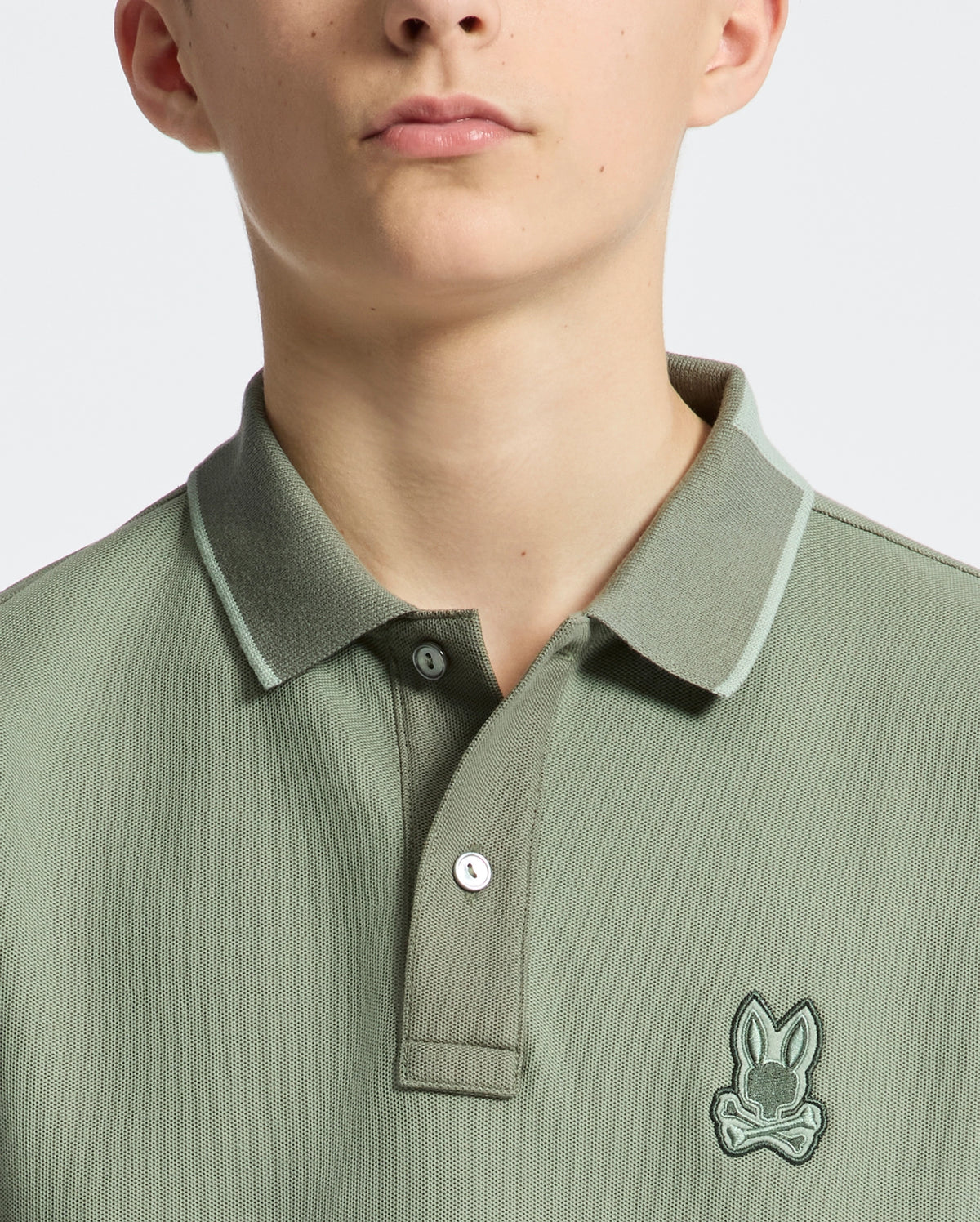 Teen | Kids' New Castle Piqué Polo in green by Psycho Bunny, featuring an embroidered logo and a classic design for a stylish, polished look.