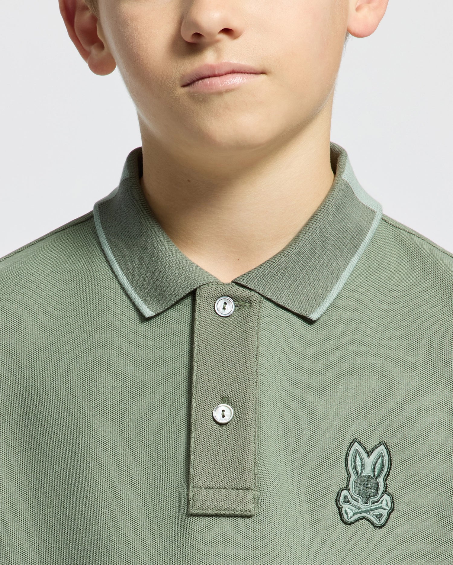 Kids | Kids' New Castle Piqué Polo in green by Psycho Bunny, featuring an embroidered logo and a classic design for a stylish, polished look.