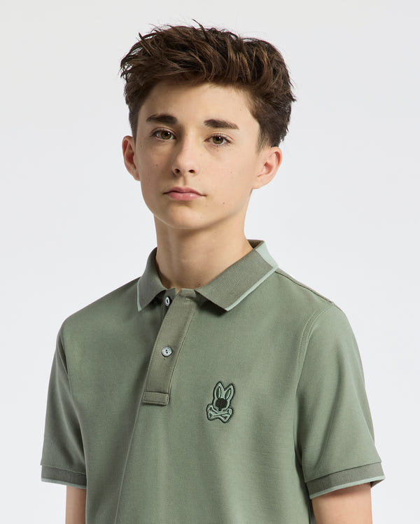 Teen | Kids' New Castle Piqué Polo in green by Psycho Bunny, featuring an embroidered logo and a classic design for a stylish, polished look.
