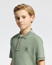 Kids | Kids' New Castle Piqué Polo in green by Psycho Bunny, featuring an embroidered logo and a classic design for a stylish, polished look.