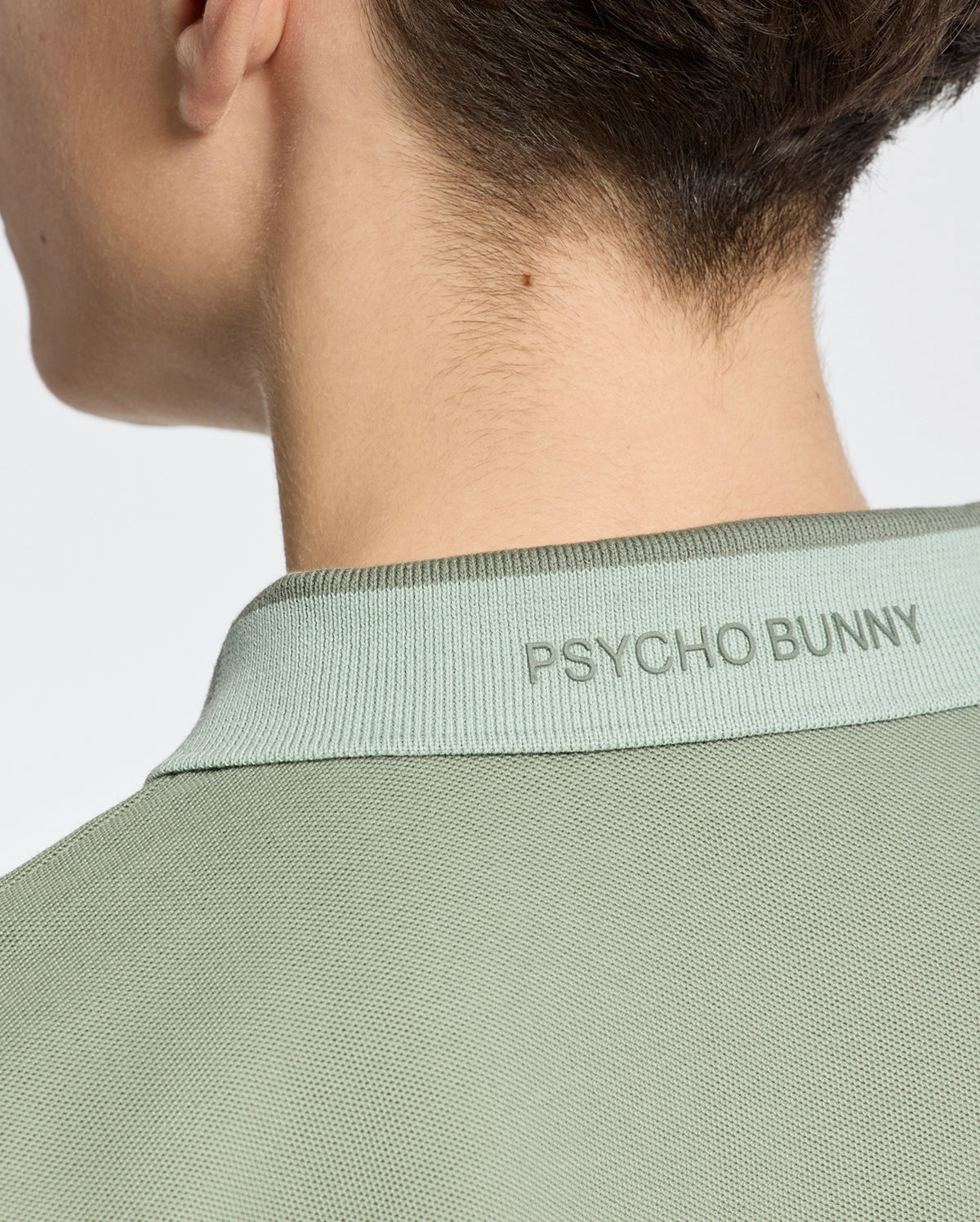 Teen | Kids' New Castle Piqué Polo in green by Psycho Bunny, featuring an embroidered logo and a classic design for a stylish, polished look.