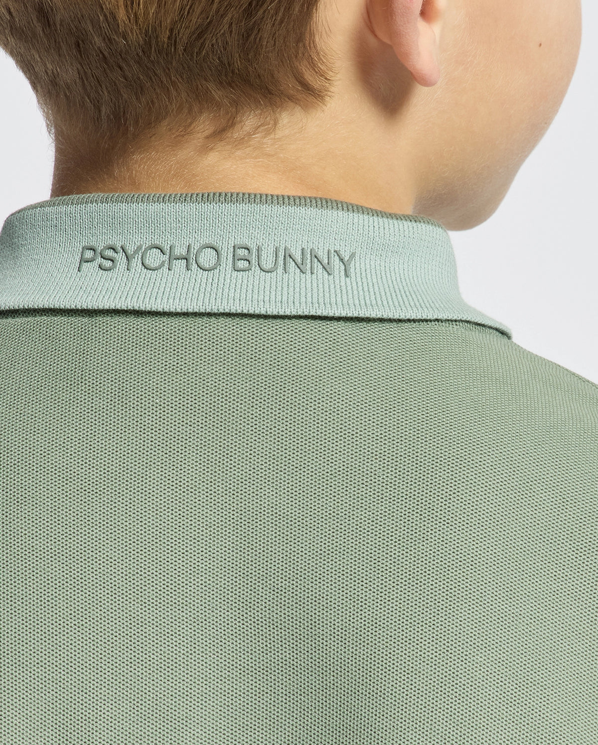 Kids | Kids' New Castle Piqué Polo in green by Psycho Bunny, featuring an embroidered logo and a classic design for a stylish, polished look.