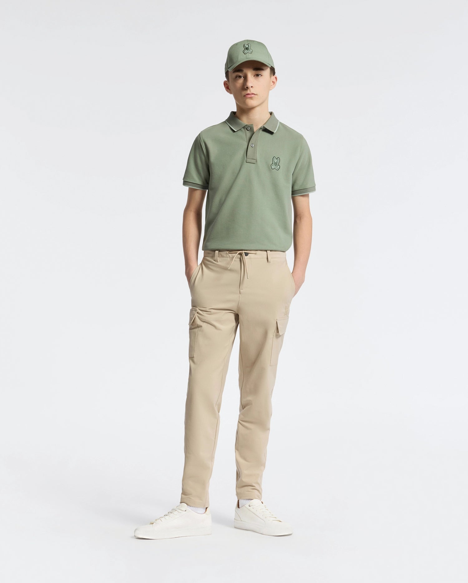 Teen | Kids' New Castle Piqué Polo in green by Psycho Bunny, featuring an embroidered logo and a classic design for a stylish, polished look.