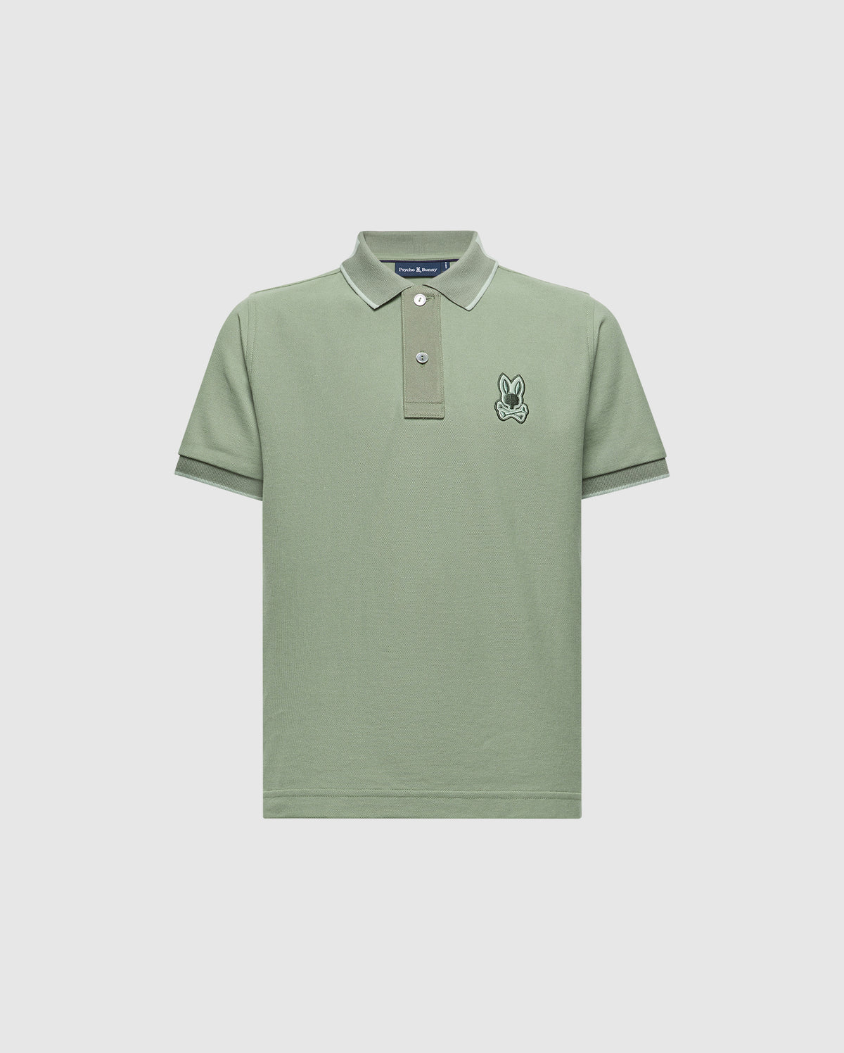 The Psycho Bunny KIDS NEW CASTLE PIQUE POLO B0K487F200 offers all-day comfort. This green polo shirt features soft Pima cotton, a small embroidered rabbit on the left chest, short sleeves, a ribbed collar with white piping, and a buttoned placket. It's a timeless wardrobe staple.