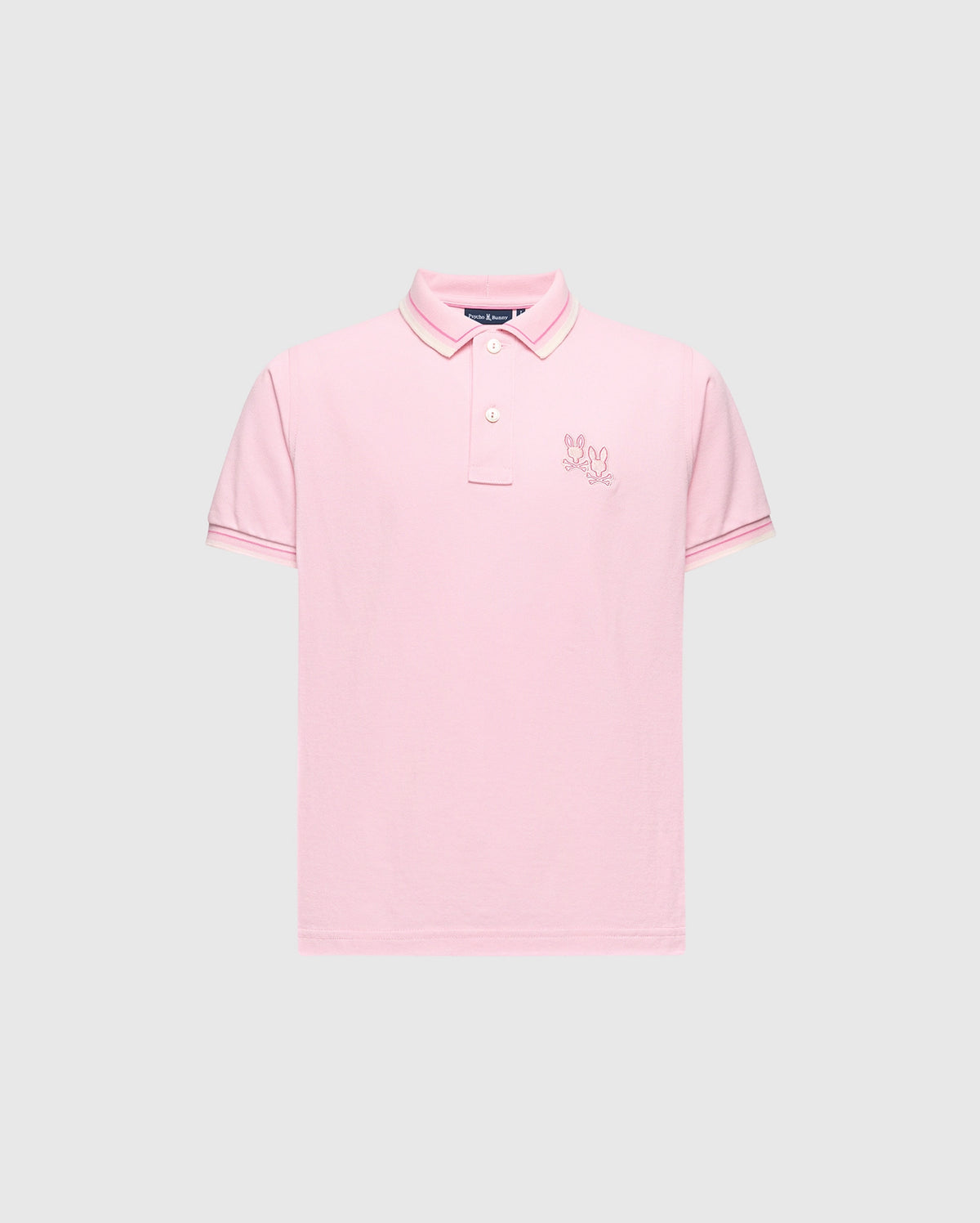 The KIDS ELLIOT PIQUE POLO - B0K505F200 by Psycho Bunny features a pink hue on a light gray backdrop. Crafted from luxurious Pima cotton, it includes short sleeves, a two-button collar, and an embroidered logo on the left chest, offering a bold design for any occasion.