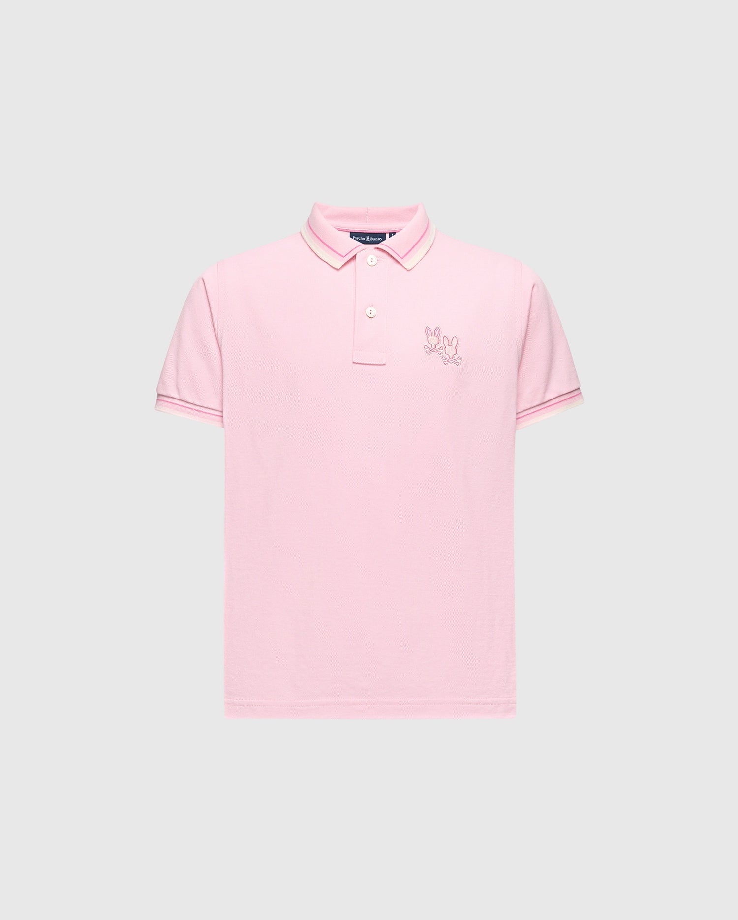 The KIDS ELLIOT PIQUE POLO - B0K505F200 by Psycho Bunny features a pink hue on a light gray backdrop. Crafted from luxurious Pima cotton, it includes short sleeves, a two-button collar, and an embroidered logo on the left chest, offering a bold design for any occasion.