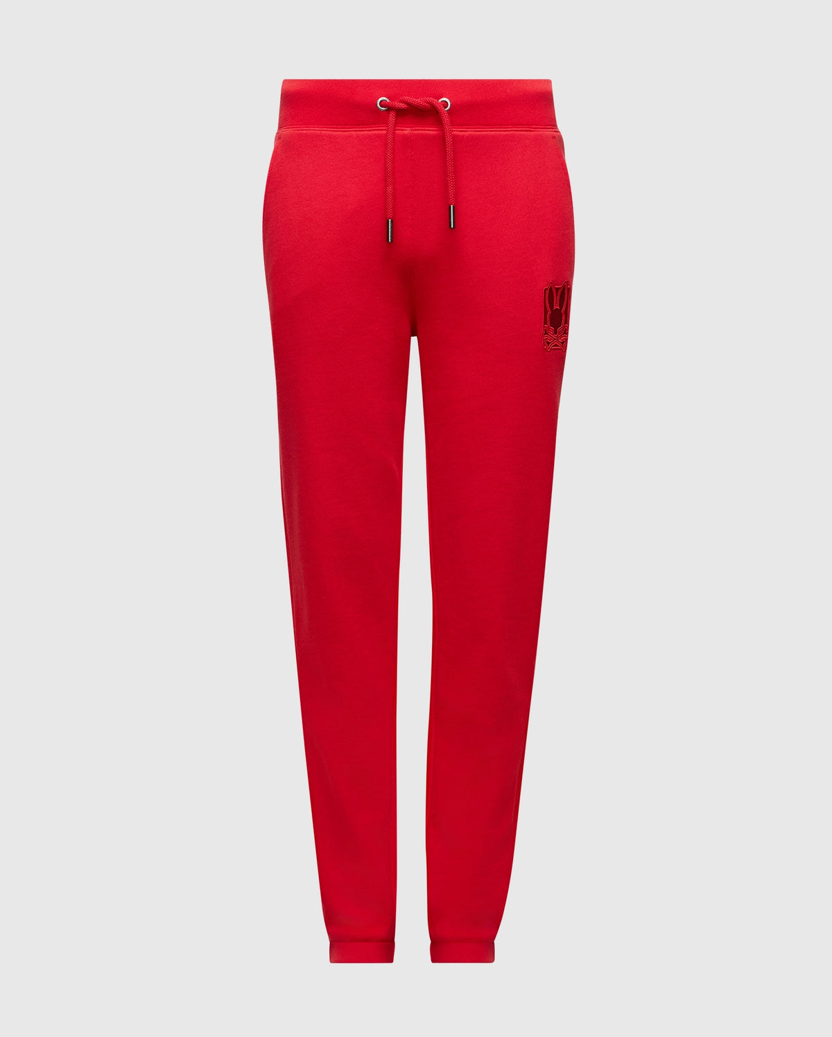 The Psycho Bunny Kids Pierce Essential French Terry Sweatpants, product code B0P136E200, come in a vibrant red and feature an adjustable drawstring waistband with a small embroidered design on one leg. Made from premium quality fabric, these joggers are shown against a white background, ensuring style and comfort for your little ones.