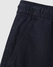 Close-up of a dark blue elasticized waistband on Psycho Bunny Kids Willis Stretch Tencel Shorts with detailed stitching and fabric texture.