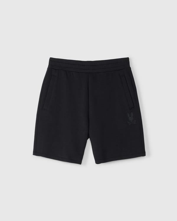 Psycho Bunny Kids Lyons sweatshorts in plain black with an elastic waistband and drawstrings, featuring two side pockets and a small embroidered rabbit design near the bottom left hem on a white background.