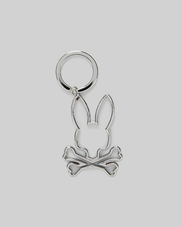 The Psycho Bunny MENS OUTLINE BUNNY KEYCHAIN (B6A565E200) features a durable silver design with a black nickel bunny head above crossed bones, adding a playful skull-and-crossbones touch to any keys.