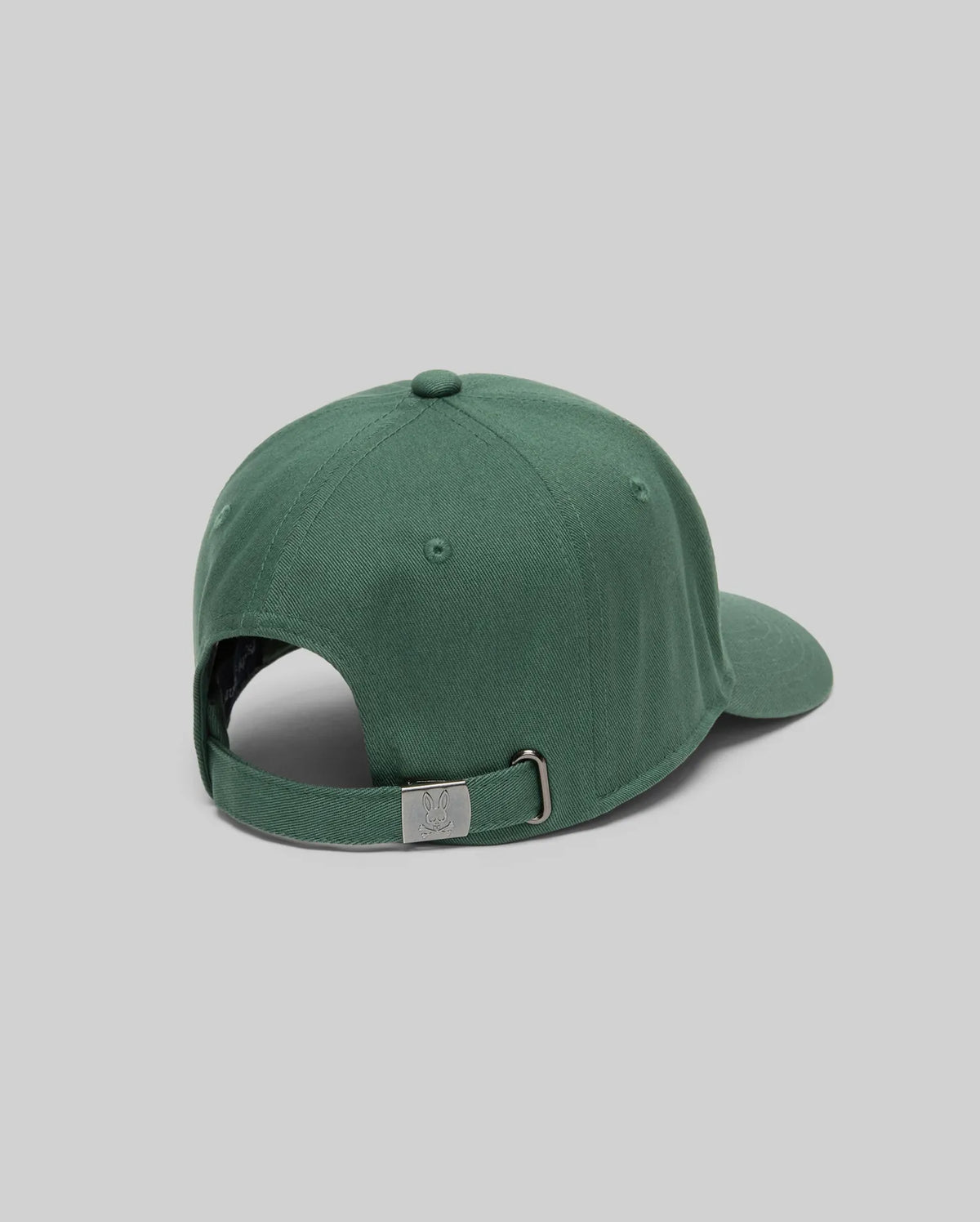 The Psycho Bunny MENS CLASSIC BASEBALL CAP (B6A816A1HT) is a green cotton hat with an adjustable metal buckle strap, curved brim, and small embroidered logo. Shown from the back against a plain light gray background.