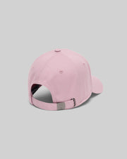 The Psycho Bunny MENS CLASSIC BASEBALL CAP - B6A816A1HT in light pink is shown from the back, highlighting its adjustable metal buckle closure, set against a plain gray background.
