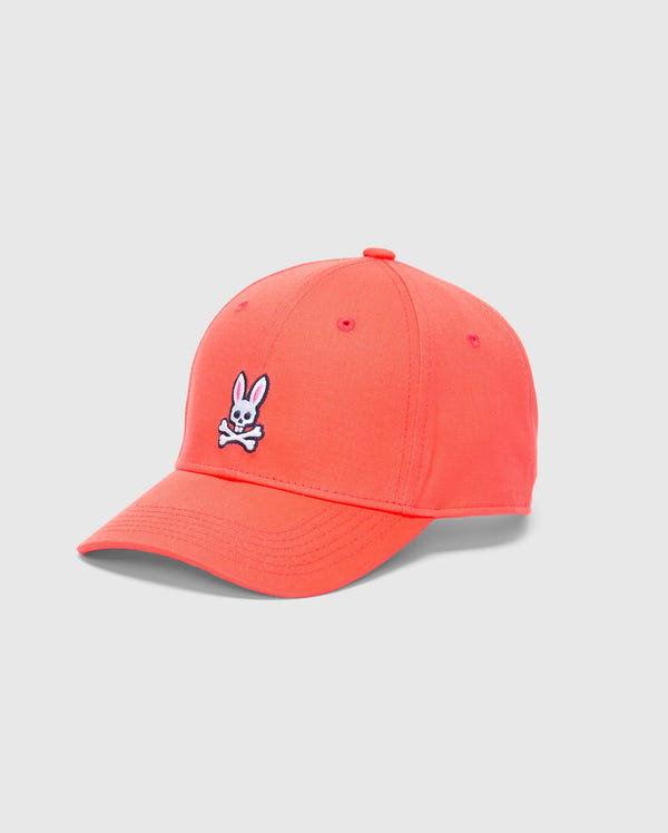 The Psycho Bunny MENS CLASSIC BASEBALL CAP - B6A816F200 is crafted from cotton twill in bright coral, featuring a curved brim and an embroidered white rabbit head with crossbones on the front. It's designed for an adjustable fit and displayed against a plain white background.
