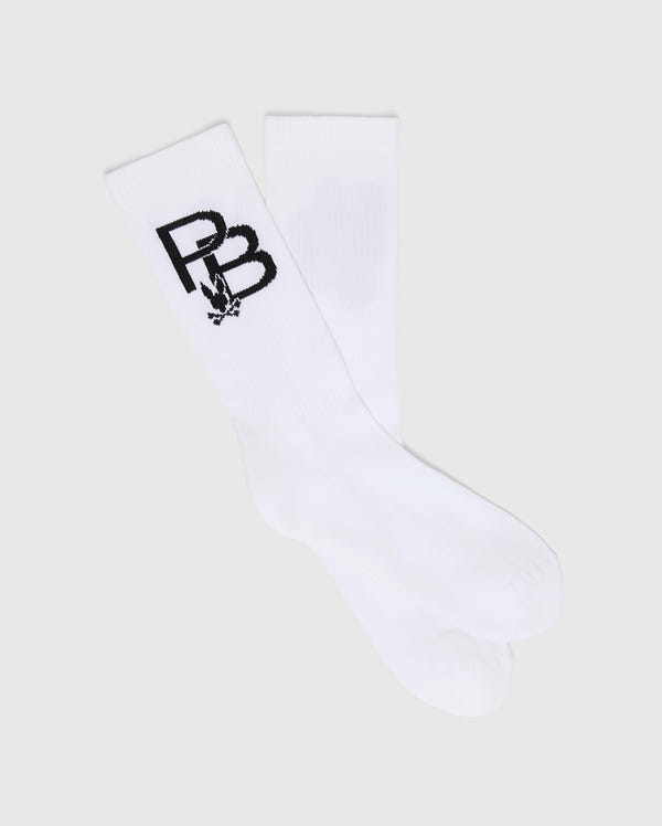 Laid flat on a light gray background, the white MENS PB SPORT SOCK by Psycho Bunny features a black "BB" logo with a floral design underneath, made from soft Pima cotton for competitive comfort.