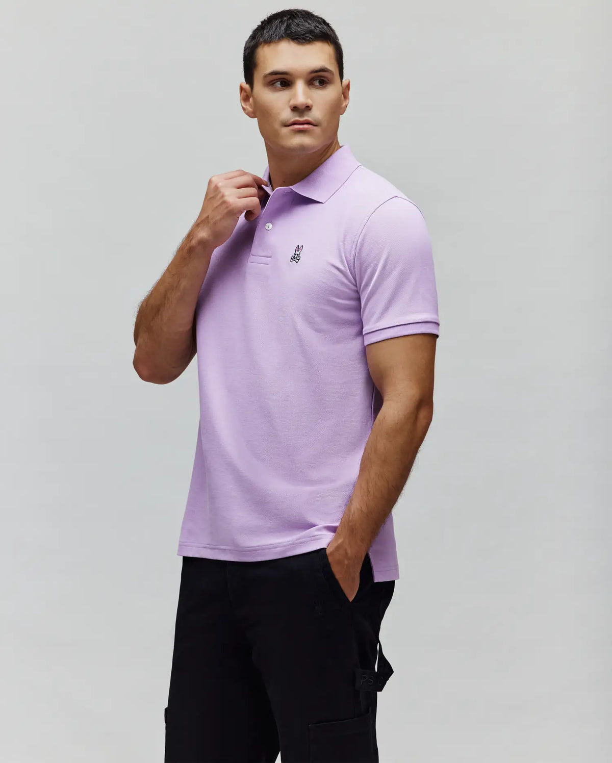 Lavender Mens Classic Pique Polo with a classic fit, textured pique knit, two-button placket, and a small black embroidered Psycho Bunny skull logo on the left chest.