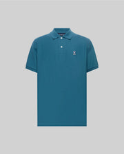 Mens Classic Pique Polo in deep teal, featuring a classic fit, pique knit texture, two white buttons, and a small embroidered white and pink Psycho Bunny skull logo on the left chest.