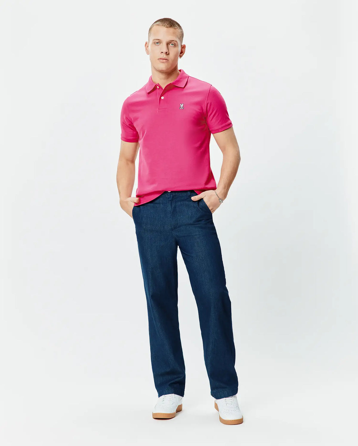 Mens Classic Pique Polo in vibrant pink, featuring a classic fit, two-button placket, and small embroidered Psycho Bunny skull logo on the left chest. (5)