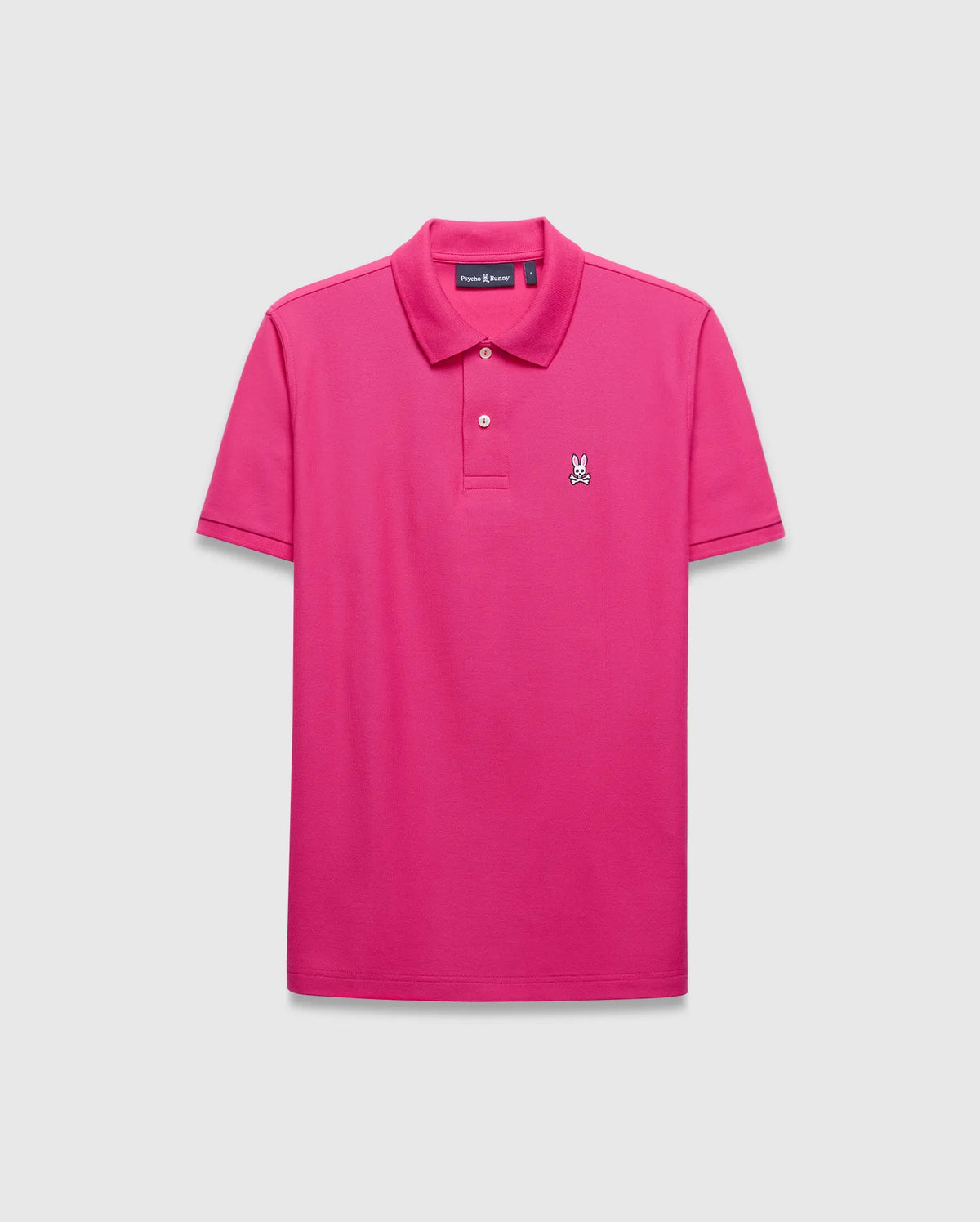 Mens Classic Pique Polo in bright pink, featuring a classic fit, pique knit texture, two-button placket, and a small, embroidered white, black, and red Psycho Bunny skull logo on the left chest. (2)
