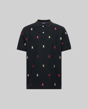 The Psycho Bunny MENS HOLLAND ALL OVER BUNNY PIQUE POLO (B6K618F200) is a black collared shirt with buttons, featuring small red, white, and yellow embroidered bunny logos scattered across the front.