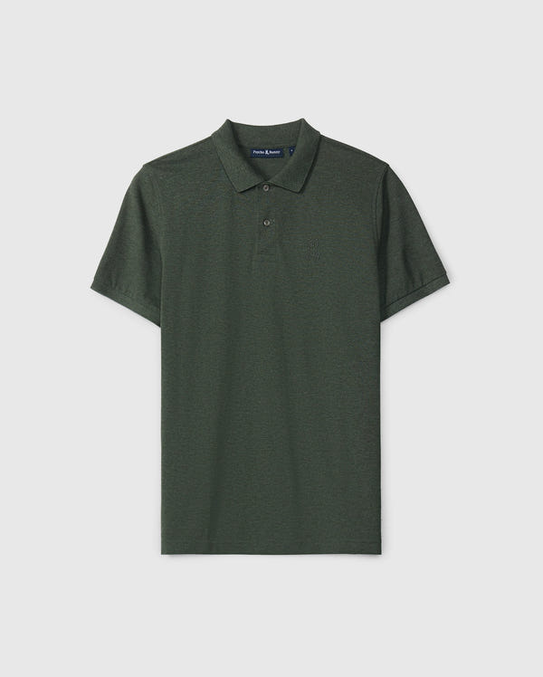 The Psycho Bunny MENS JAMES PREMIUM PIQUE POLO SHIRT - B6K945D200 is a high-quality men's polo in dark green, featuring a collar and short sleeves with a subtle embroidered logo on the left chest. Crafted from premium pique fabric, it stands out against a plain white background, emphasizing its refined elegance.