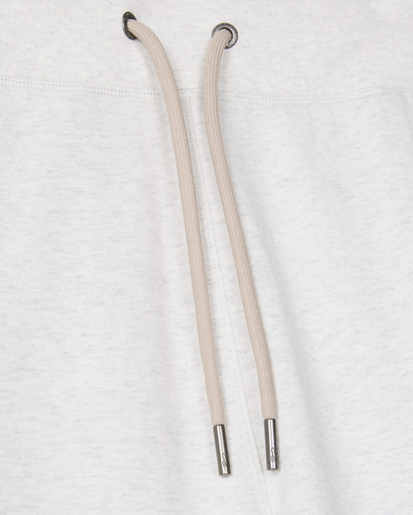 Close-up of a light gray cotton-blend drawstring hoodie featuring two tan drawstrings with metal tips against the fabric. The drawstrings descend from metal eyelets at the neck area, beautifully pairing with Psycho Bunny's MENS JAMES PREMIUM SWEATPANT - B6P791D200 for a stylish and comfortable ensemble.