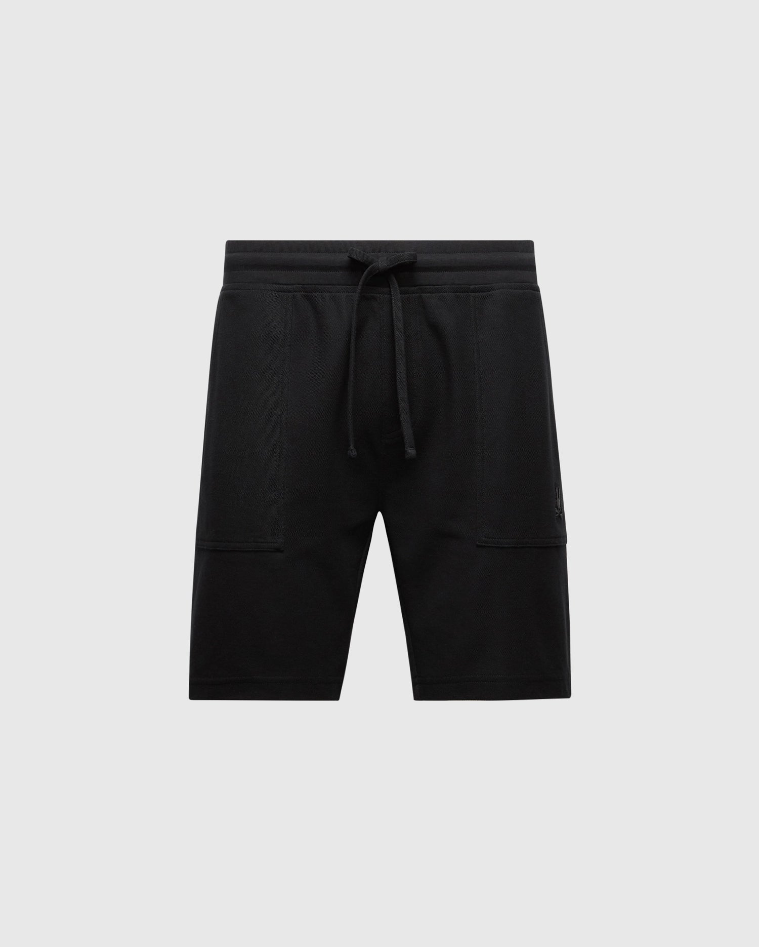 The Psycho Bunny Men's Taylor Light Pique Sweatshorts in black, made from Pima cotton, feature a drawstring waistband and two side pockets—ideal for a casual-chic look—set against a plain light gray background.