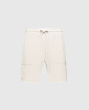 The MENS TAYLOR LIGHT PIQUE SWEATSHORT by Psycho Bunny is crafted from lightweight Pima cotton, featuring an elastic waistband and two front pockets, all showcased against a light gray backdrop for a casual-chic appeal. B6R344F200.